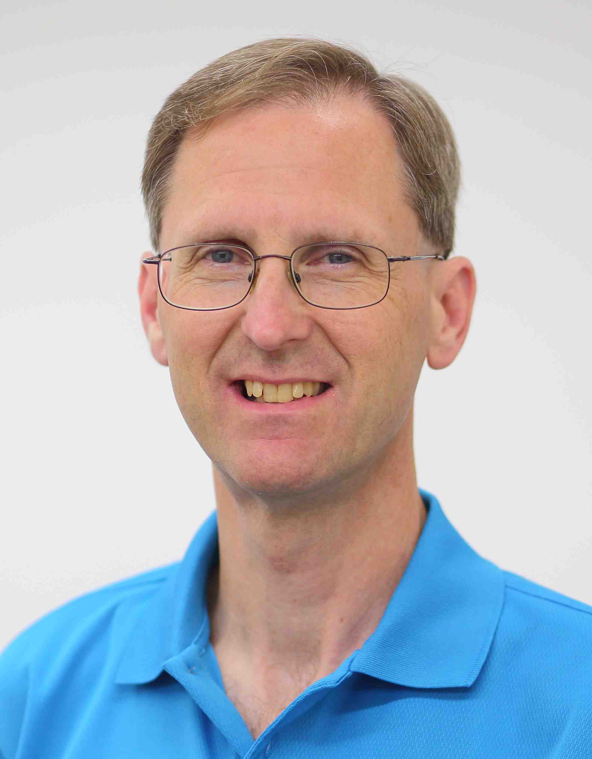 a head shot of Eugene Wallingford, wearing a blue shirt